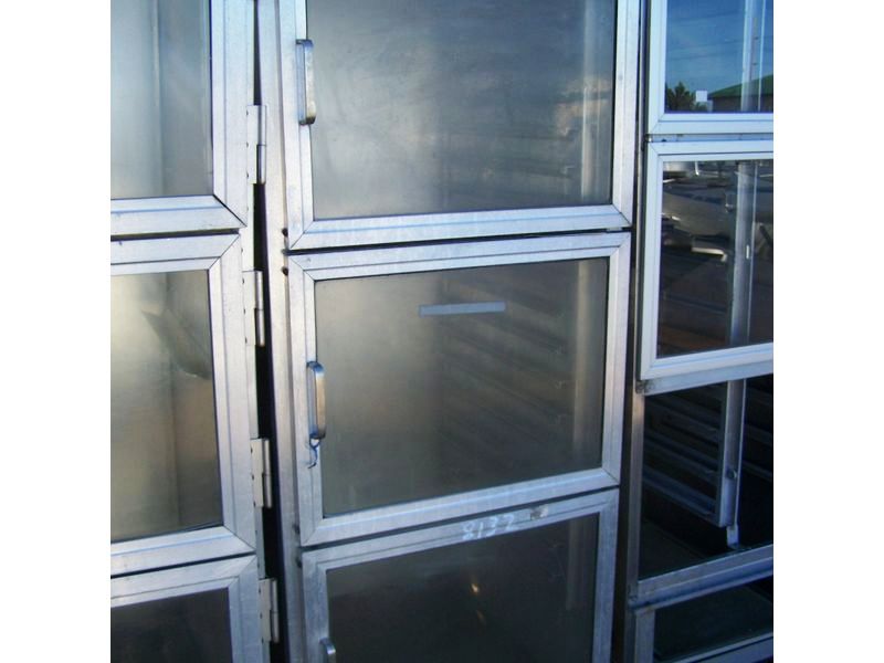 BEVLES ENCLOSED HOLDING CABINET ON CASTERS W 3 POLY DOORS 29 X 3