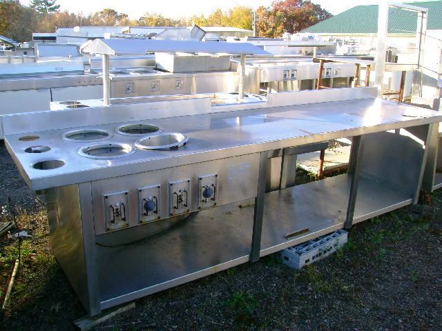 STAINLESS STEEL TABLE WITH UNDERSHELF AND 4 ROUND STEAM HOLES 11